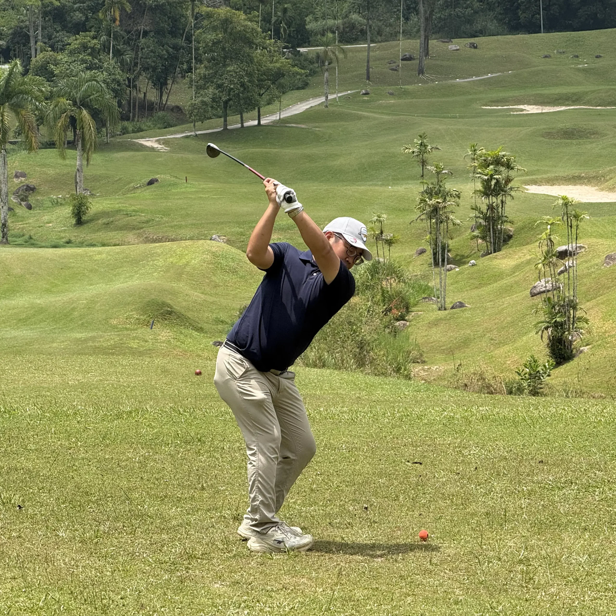 Golfer Hitting a Hybrid 4