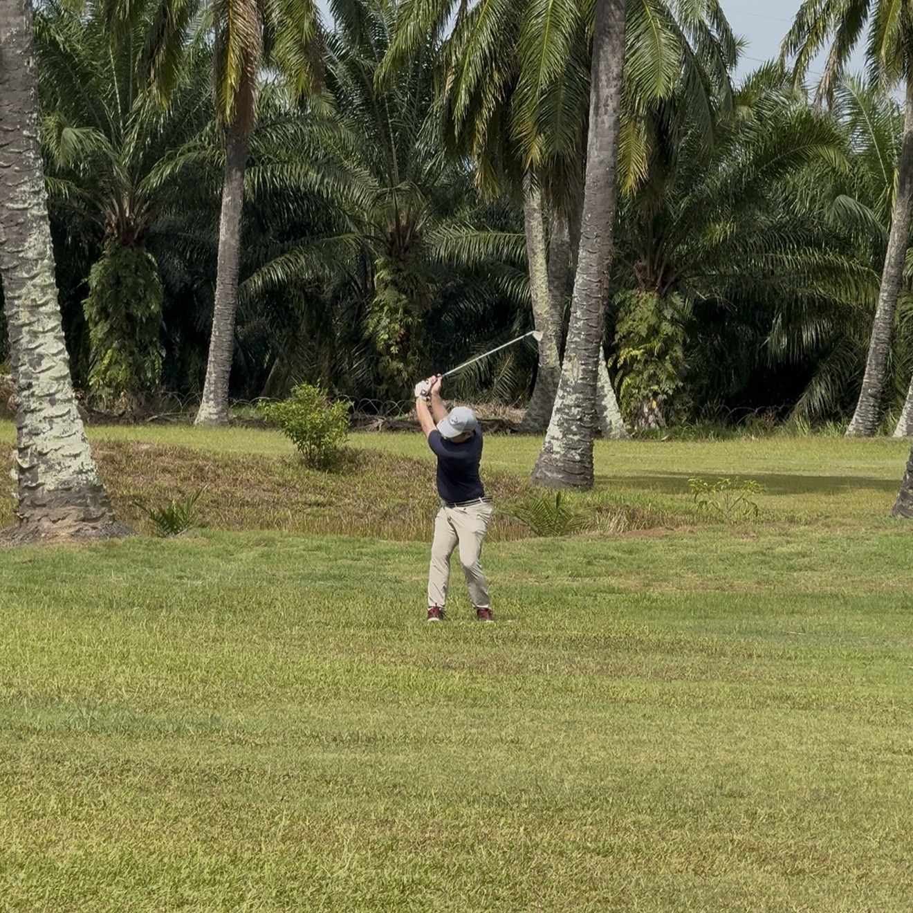 Kayden hitting a 7i on the fairway